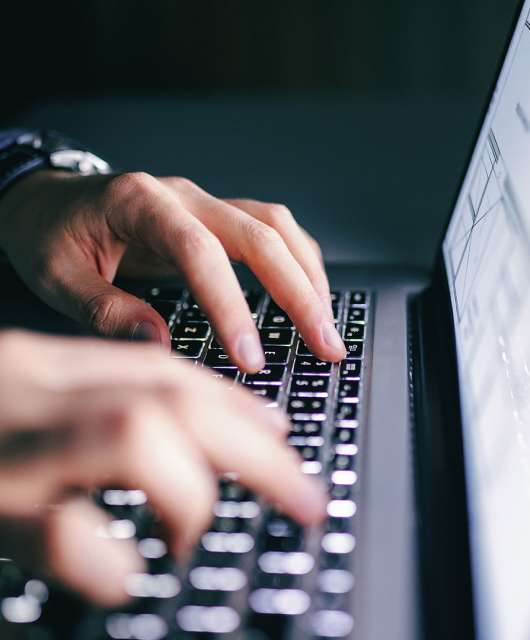 hands-typing-on-laptop-keyboard